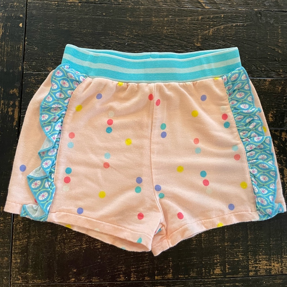 Gently used Matilda Jane girls size 4 shorts soft pink with blue ruffles sides.